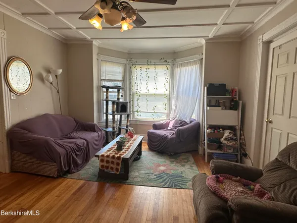 a living room with furniture and a table