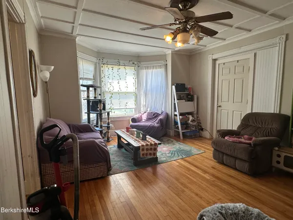 a kitchen with refrigerator and cabinets