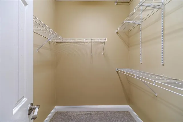 a bathroom with a double vanity sink mirror and chandelier