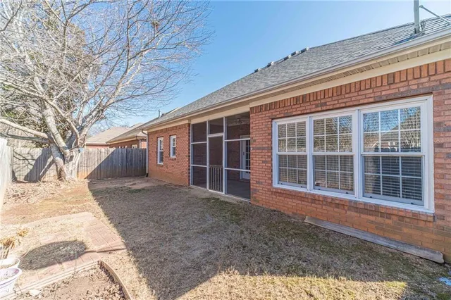 a view of a backyard with pathway
