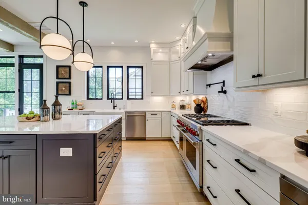 a kitchen with sink cabinets and window