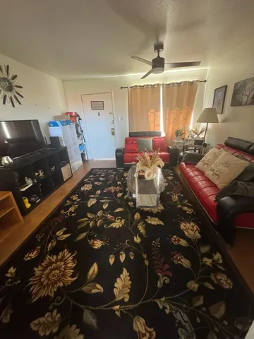 a living room with furniture and a window