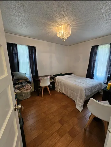 a bedroom with a bed and a table