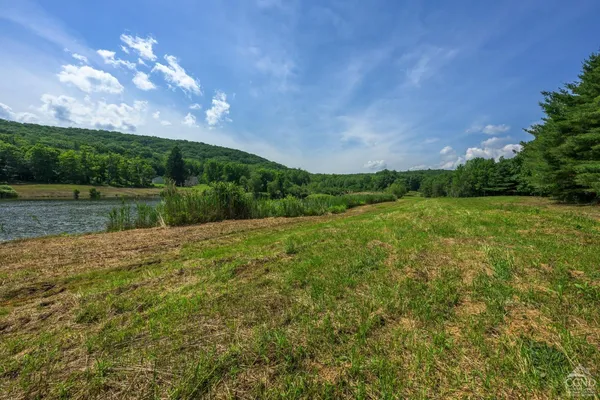 a view of a lake with a yard