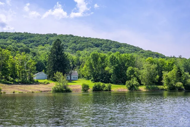 a view of a lake with a yard