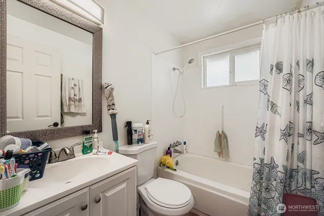 a bathroom with a sink a toilet and a bathtub