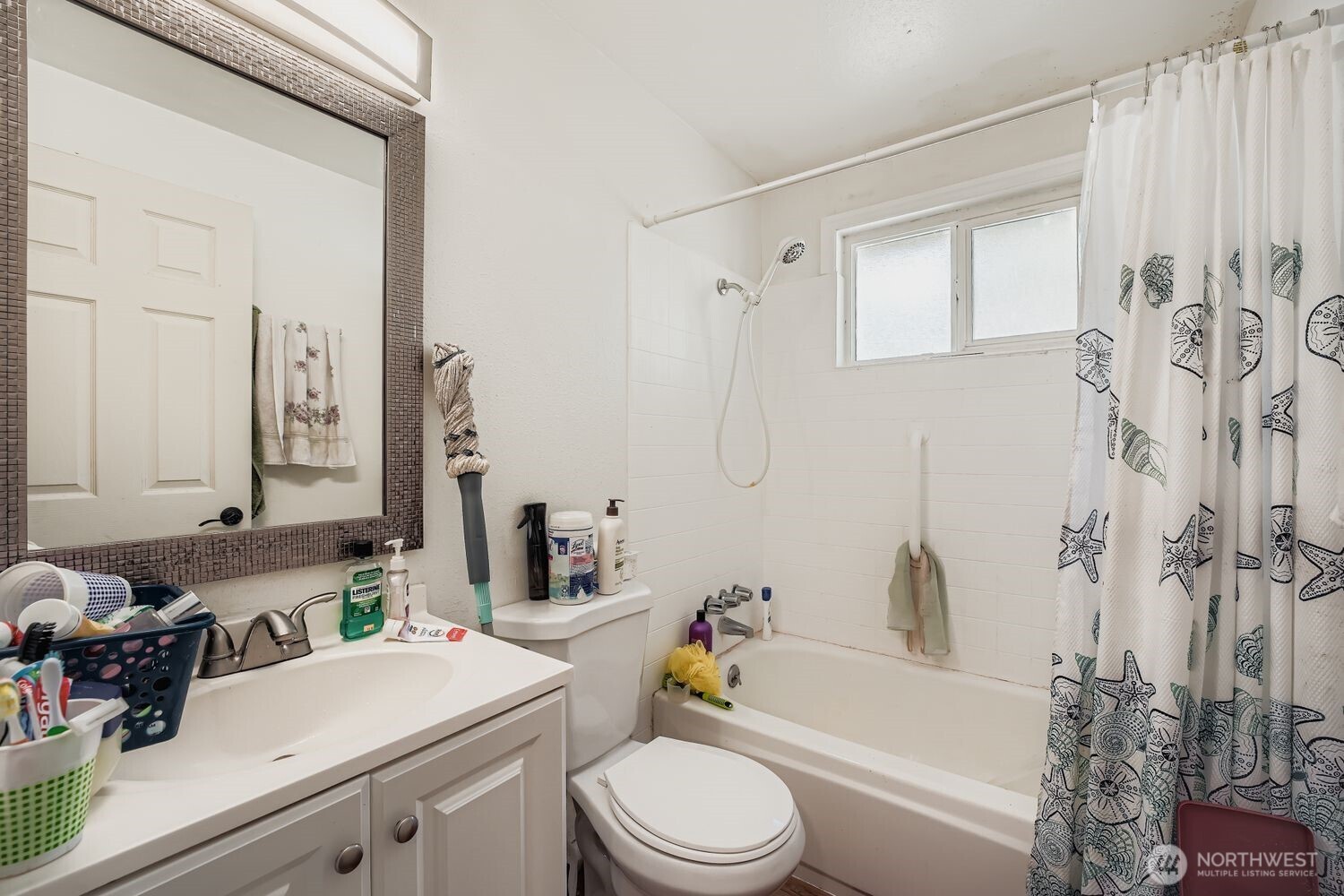 1126 Neil Street Northeast Olympia, WA 98516 - Photo 14 of 21 a bathroom with a sink a toilet and a bathtub