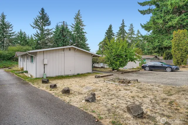 a backyard of a house with lots of green space