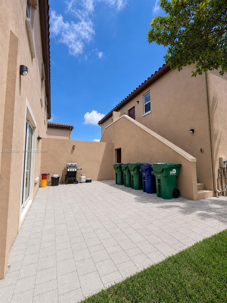 17001 Southwest 96th Street Miami, FL 33196 - Photo 17 of 23 a view of a house with a patio