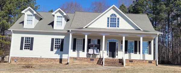 a front view of a house with glass windows