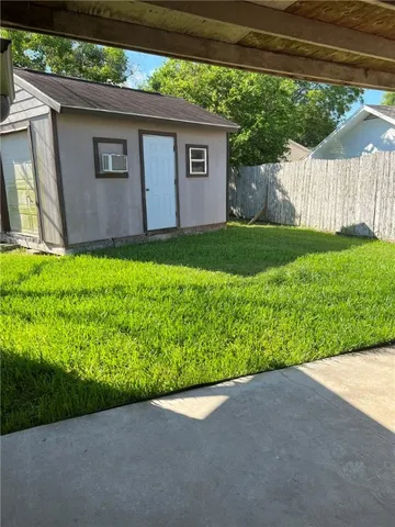 a backyard of a house with lots of green space