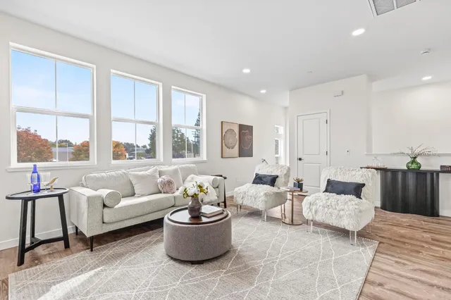 a living room with furniture and windows