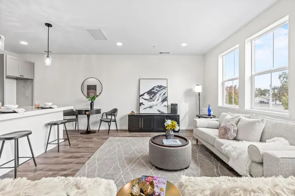 a living room with furniture and a large window