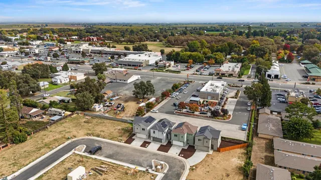 an aerial view of residential houses with outdoor space