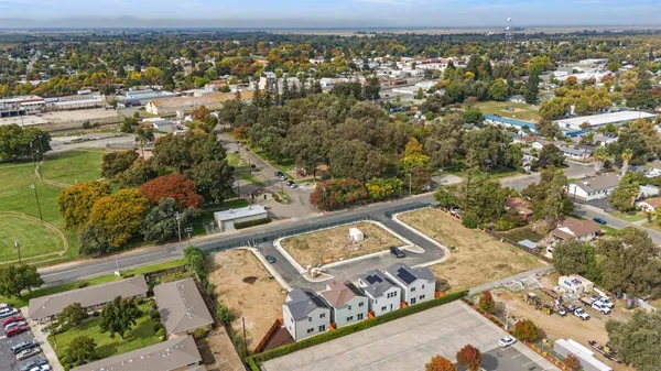 an aerial view of residential houses with outdoor space