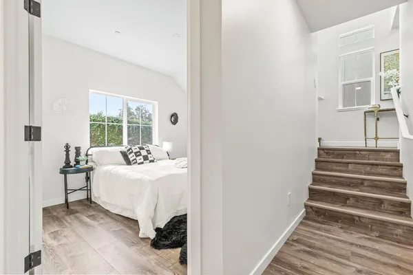 a room with a bed and a table chair