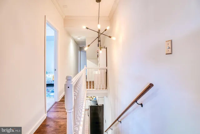 a view of a hallway with staircase