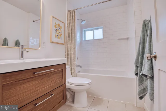 a bathroom with a sink a toilet and a bathtub