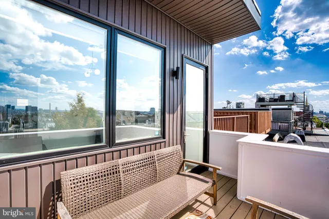 a view of a balcony with furniture