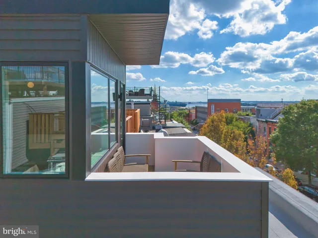a view of swimming pool from a balcony