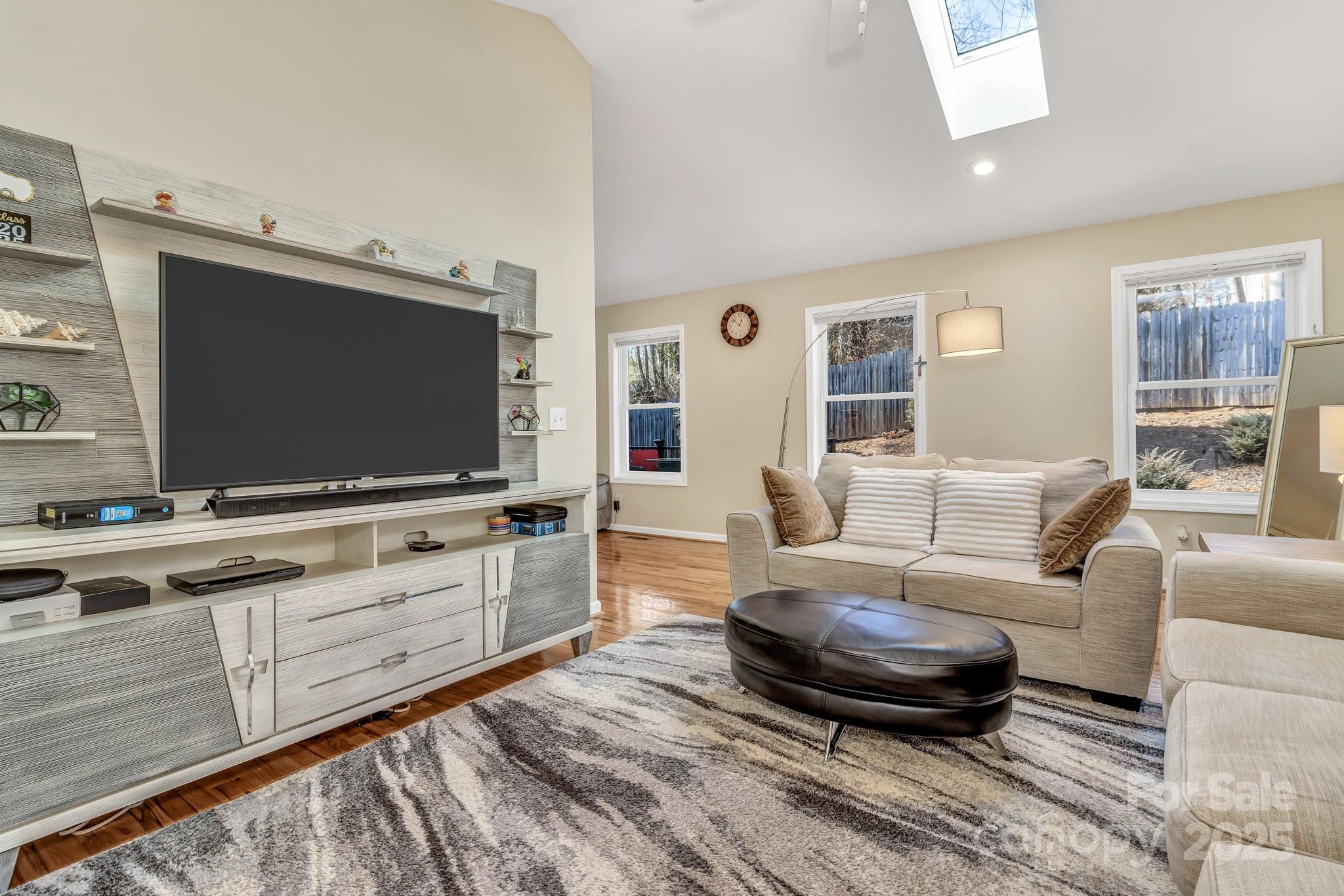 210 Allen Paul Road Hendersonville, NC 28791 - Photo 11 of 48 a living room with furniture and a flat screen tv