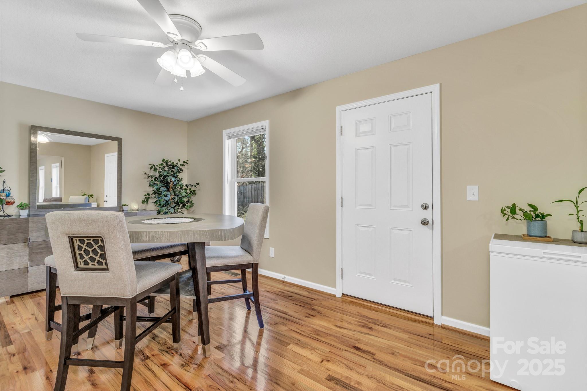 210 Allen Paul Road Hendersonville, NC 28791 - Photo 15 of 48 a view of a dining room with furniture and window