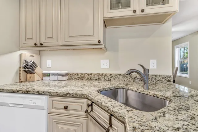 a kitchen with granite countertop a sink and granite top