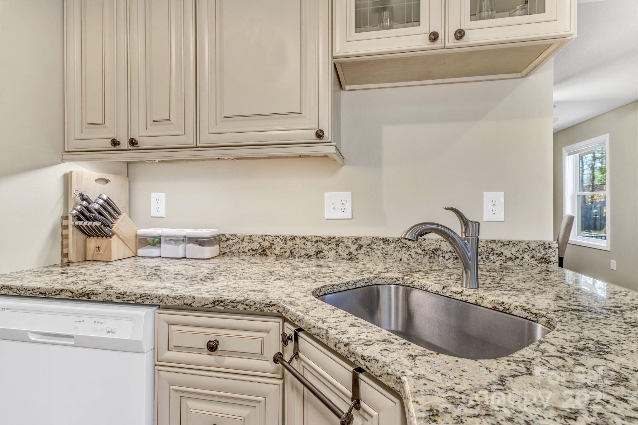 210 Allen Paul Road Hendersonville, NC 28791 - Photo 25 of 48 a kitchen with granite countertop a sink and granite top