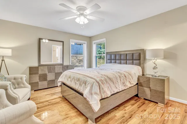 a spacious bedroom with a bed and window