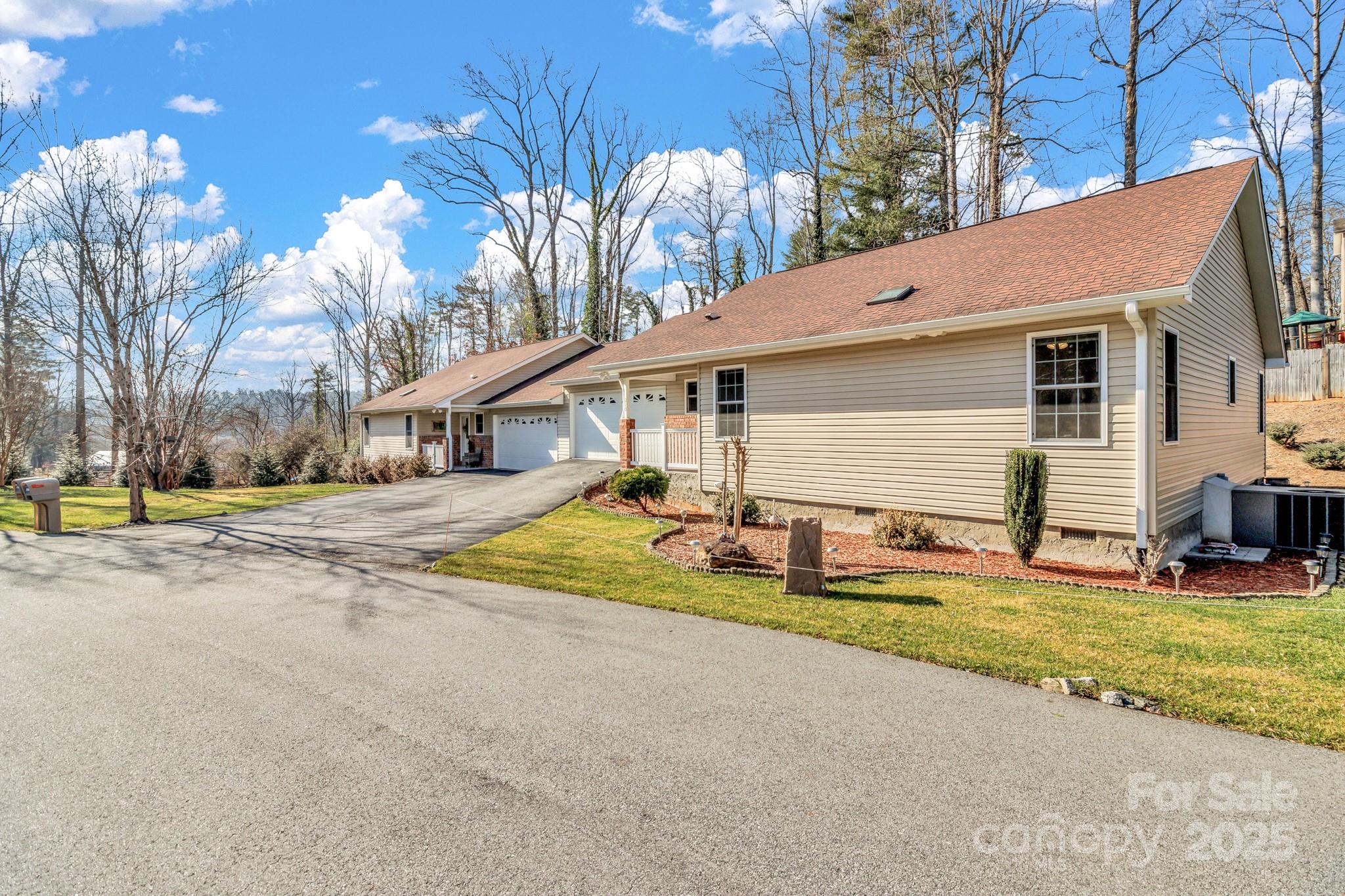 210 Allen Paul Road Hendersonville, NC 28791 - Photo 3 of 48 a view of a house with backyard and sitting area