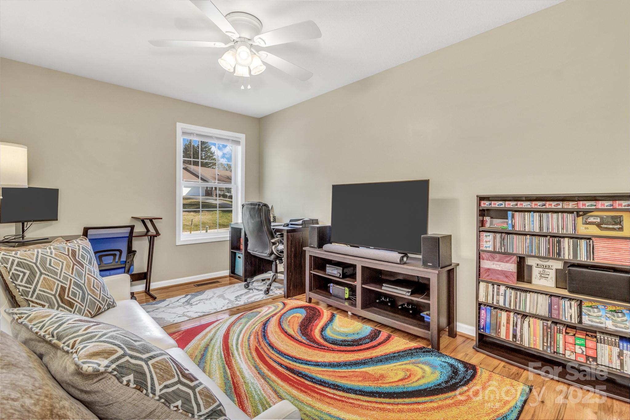 210 Allen Paul Road Hendersonville, NC 28791 - Photo 39 of 48 a living room with furniture and a flat screen tv