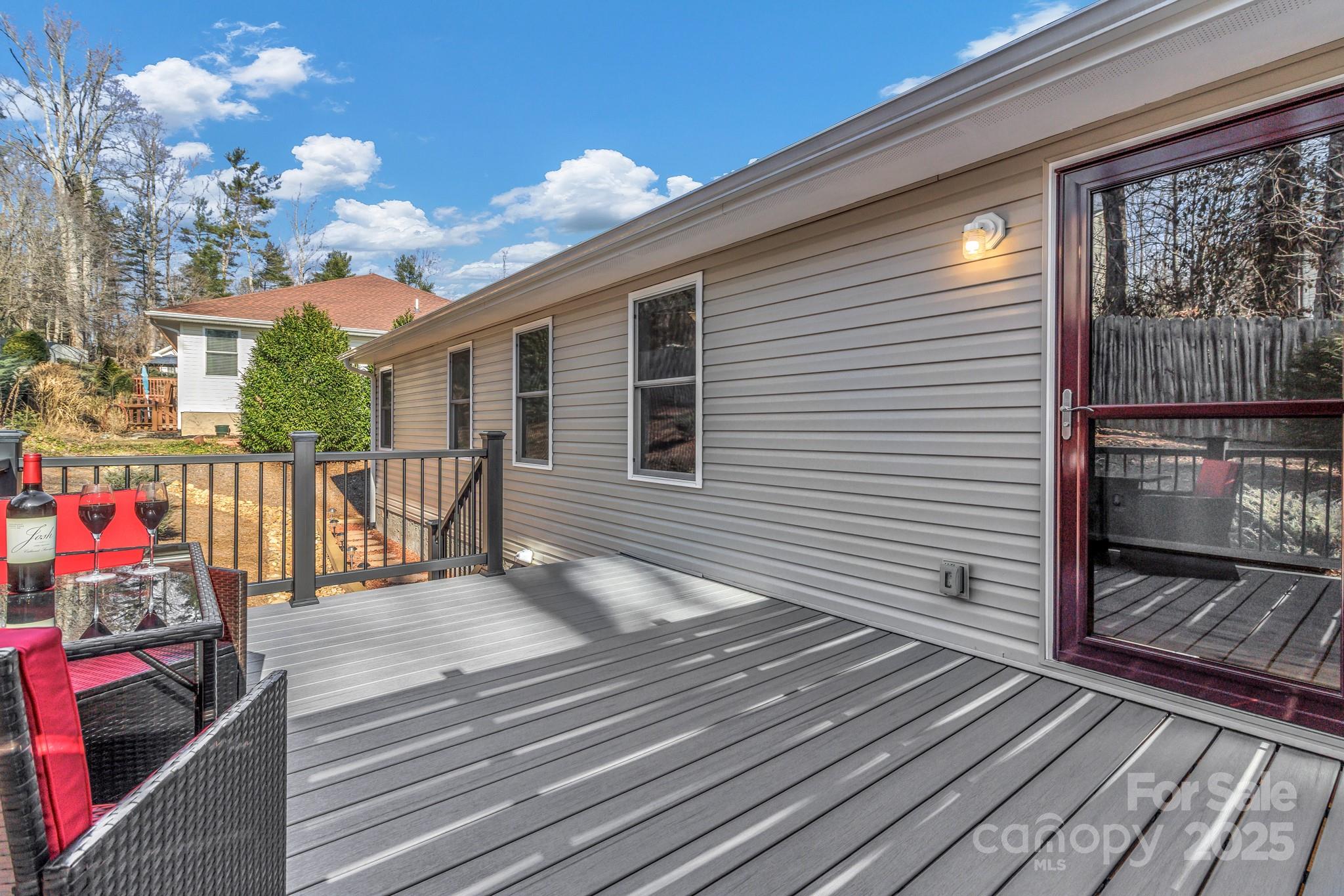 210 Allen Paul Road Hendersonville, NC 28791 - Photo 42 of 48 a view of a balcony with wooden floor
