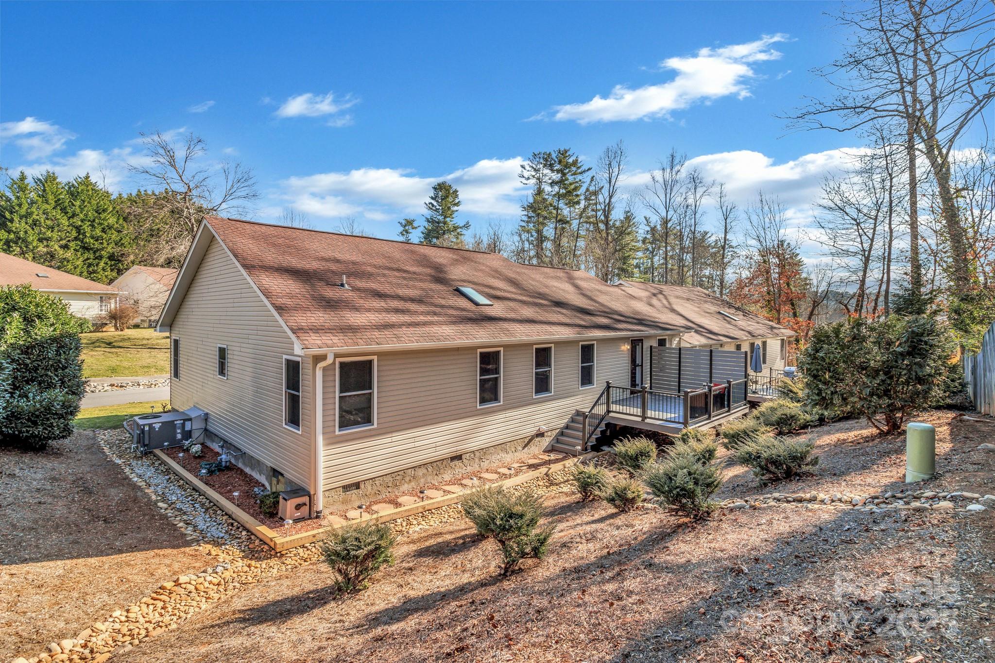 210 Allen Paul Road Hendersonville, NC 28791 - Photo 45 of 48 a view of a house with a yard