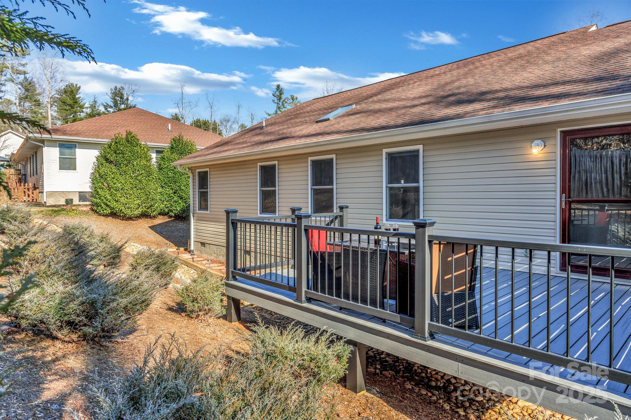 210 Allen Paul Road Hendersonville, NC 28791 - Photo 46 of 48 a view of a house with wooden floor roof and wooden fence