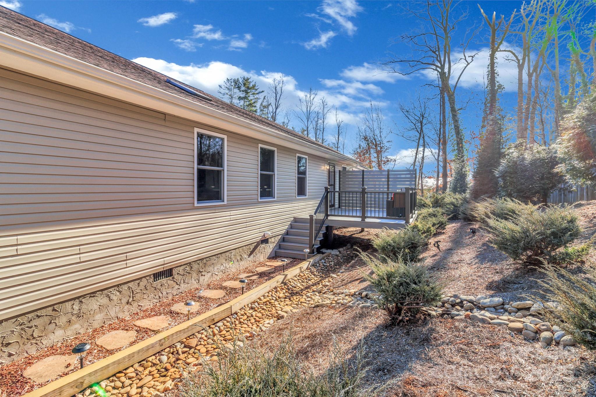 210 Allen Paul Road Hendersonville, NC 28791 - Photo 47 of 48 a backyard of a house with lots of green space