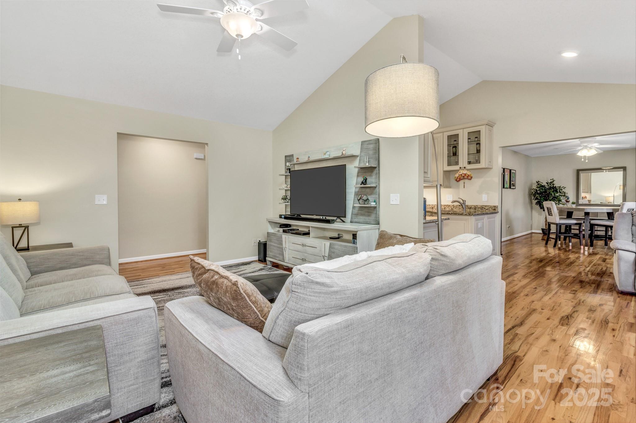 210 Allen Paul Road Hendersonville, NC 28791 - Photo 10 of 48 a living room with furniture and a flat screen tv