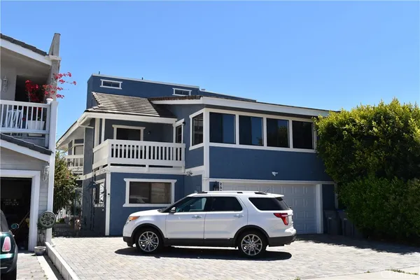 a view of a car parked in front of a house