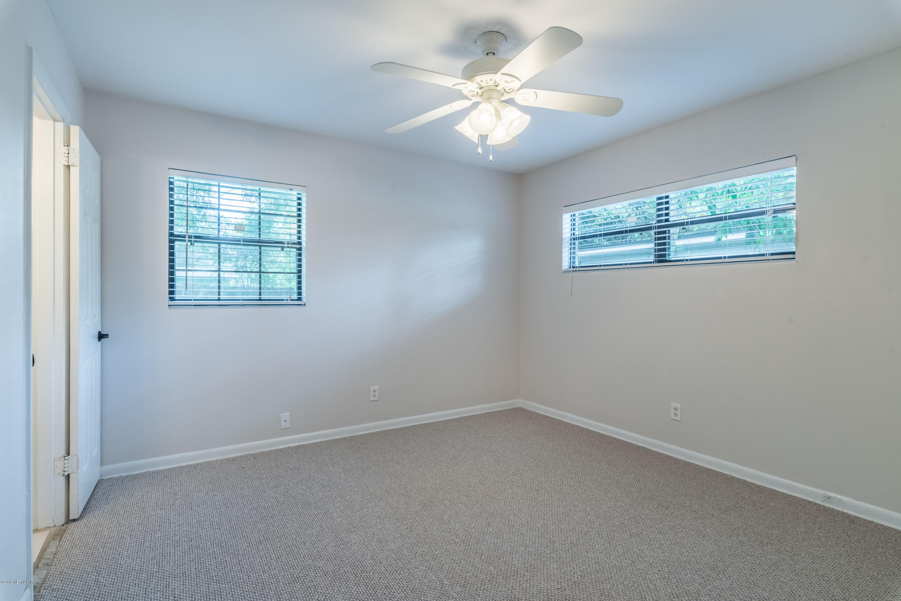 7477 Strato Road Jacksonville, FL 32210 - Photo 15 of 25 an empty room with a window