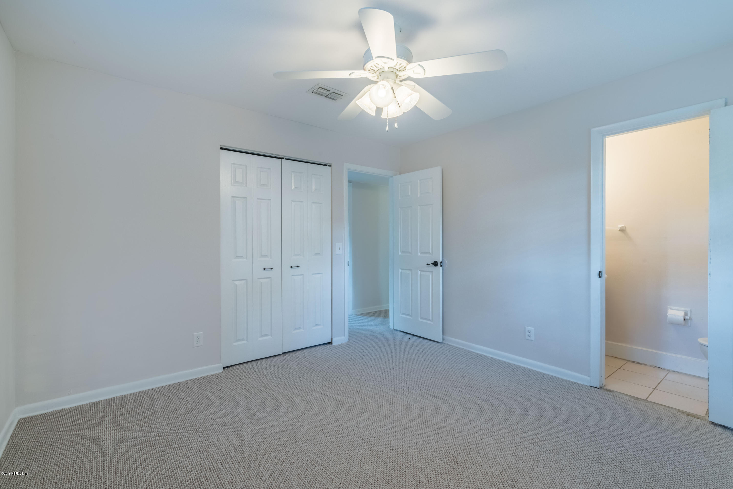 7477 Strato Road Jacksonville, FL 32210 - Photo 16 of 25 wooden floor in an empty room