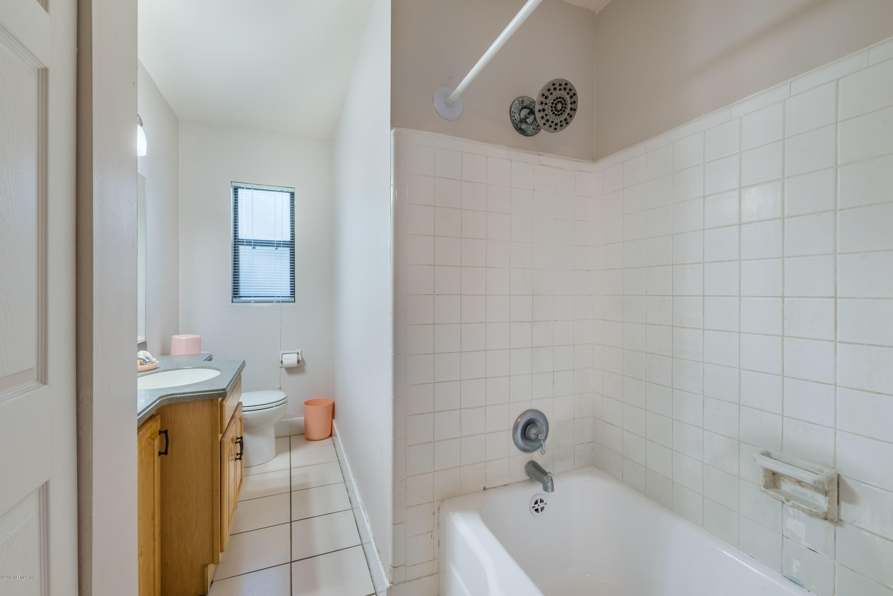 7477 Strato Road Jacksonville, FL 32210 - Photo 20 of 25 a bathroom with a bathtub and shower