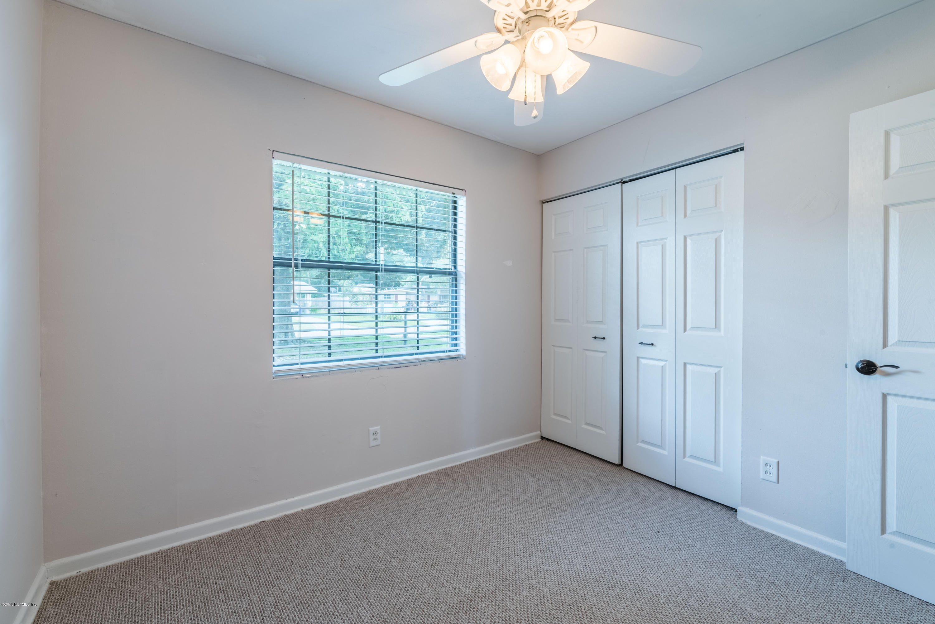 7477 Strato Road Jacksonville, FL 32210 - Photo 21 of 25 a view of an empty room with a window