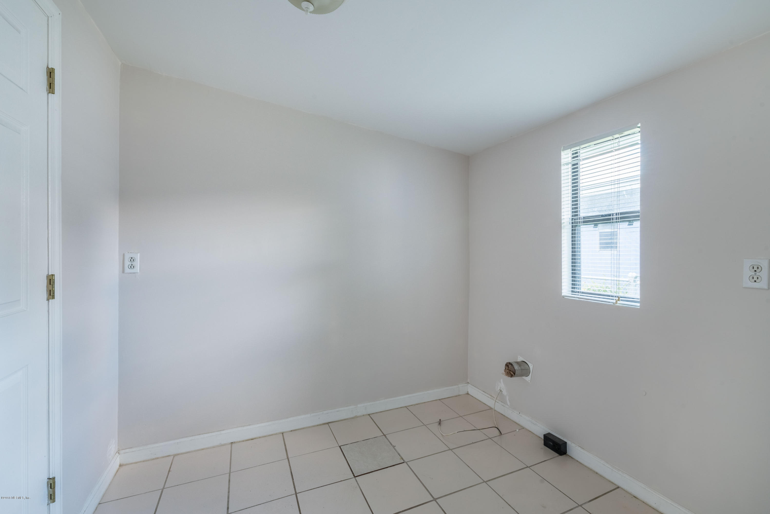 7477 Strato Road Jacksonville, FL 32210 - Photo 22 of 25 a view of an empty room and window