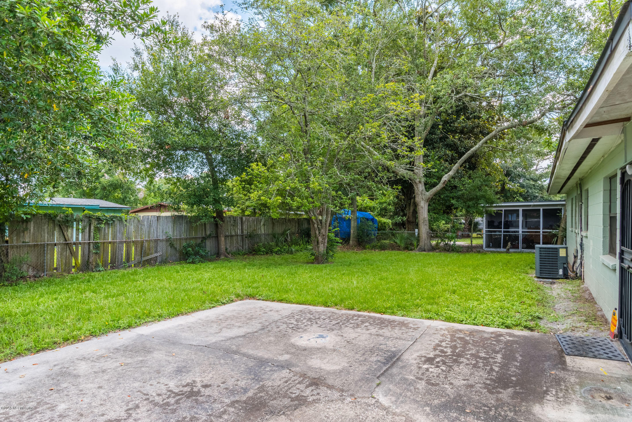 7477 Strato Road Jacksonville, FL 32210 - Photo 23 of 25 a view of a yard with a house and large trees
