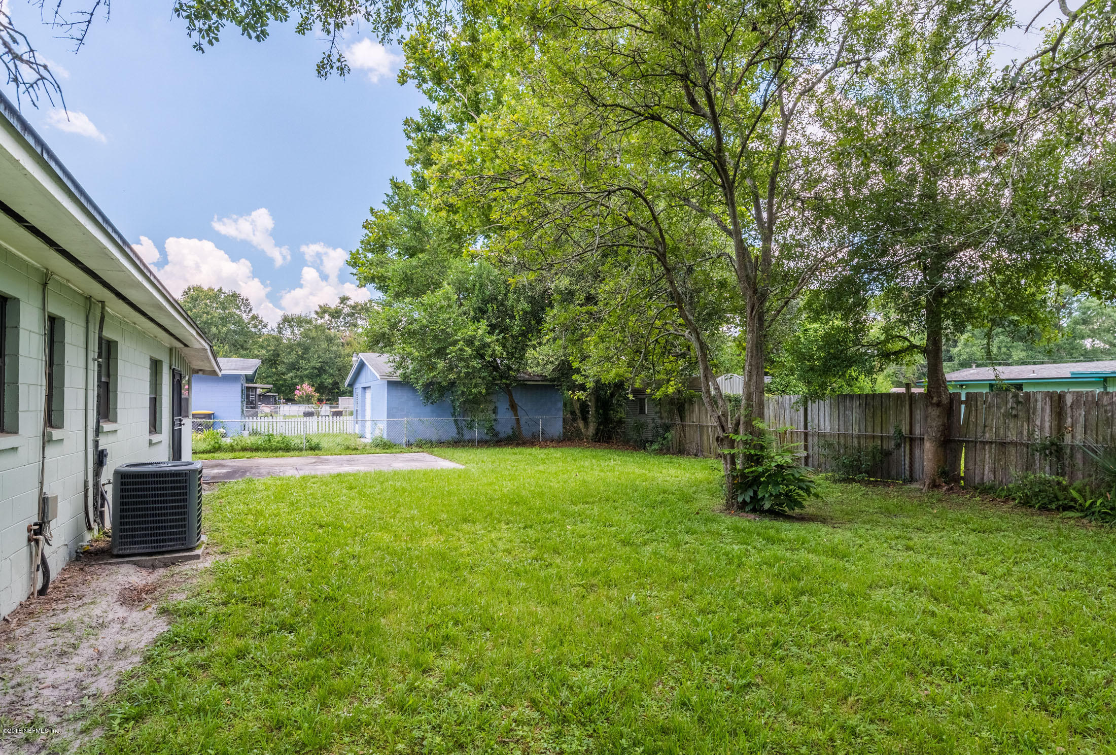 7477 Strato Road Jacksonville, FL 32210 - Photo 24 of 25 a view of a backyard with a small cabin