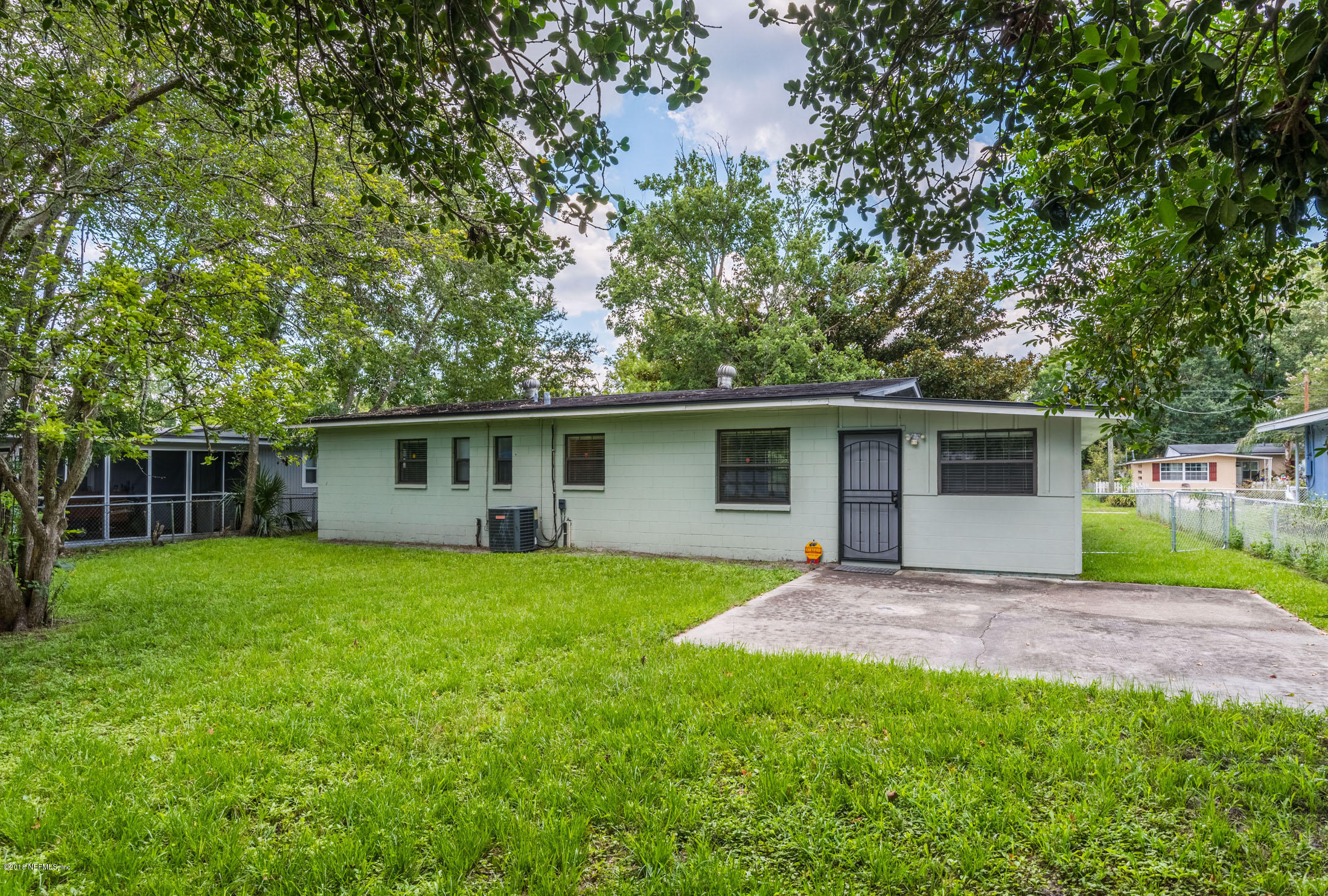 7477 Strato Road Jacksonville, FL 32210 - Photo 25 of 25 front view of a house with a yard