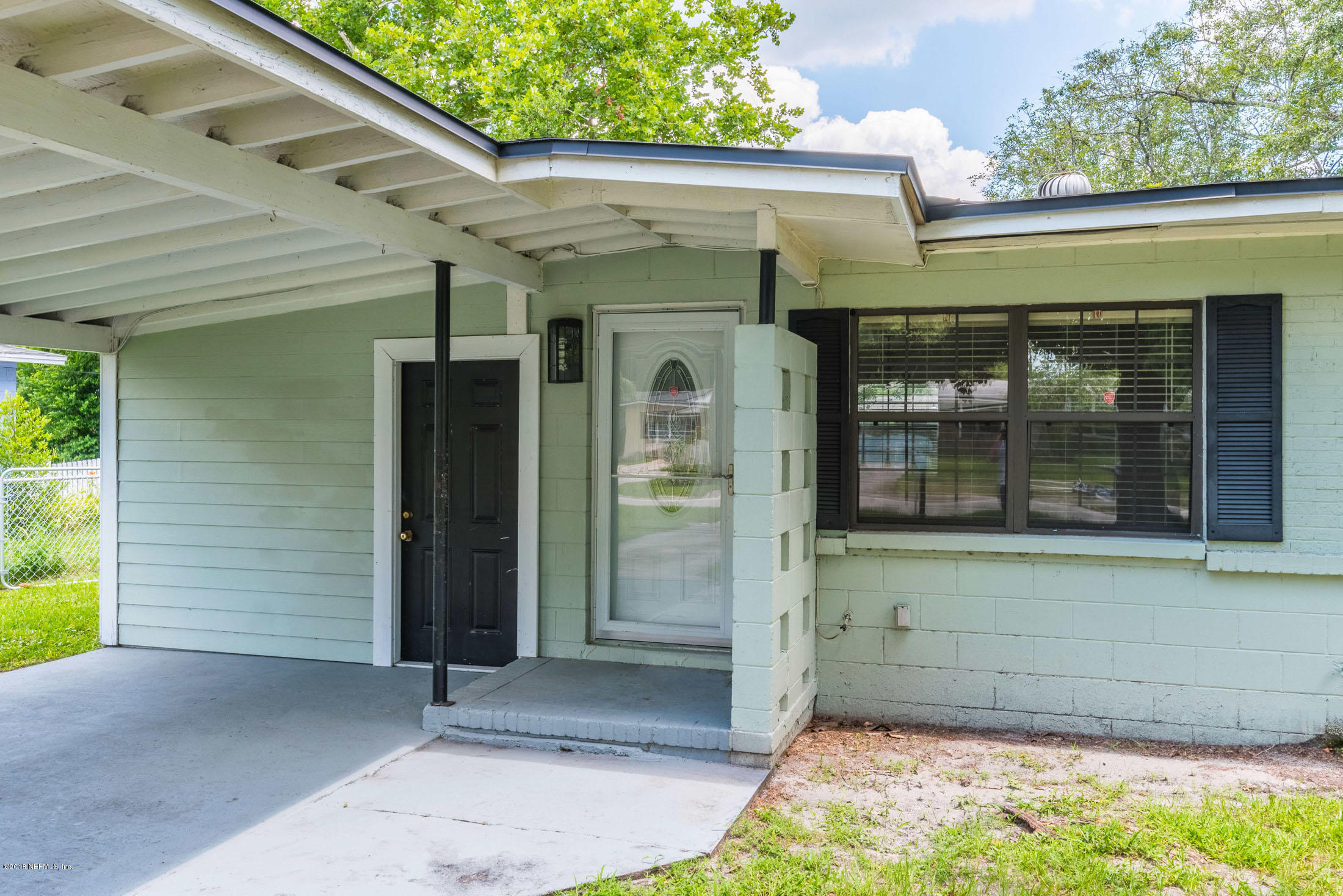 7477 Strato Road Jacksonville, FL 32210 - Photo 4 of 25 a front view of a house