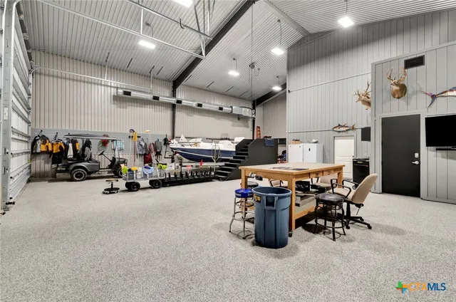 a room with gym equipment and parked equipment