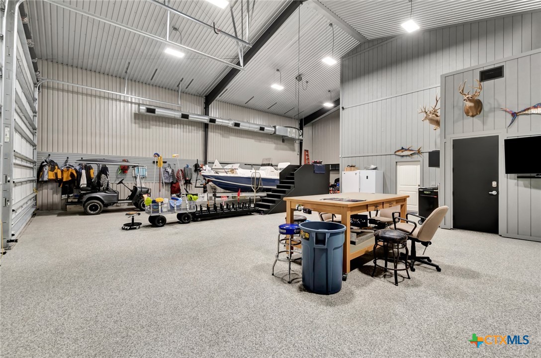 52 Coastal Oaks Loop Port O'Connor, TX 77982 - Photo 2 of 23 a room with gym equipment and parked equipment