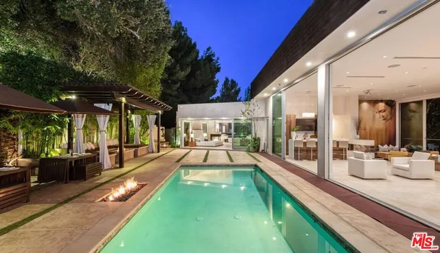 a view of swimming pool with outdoor seating