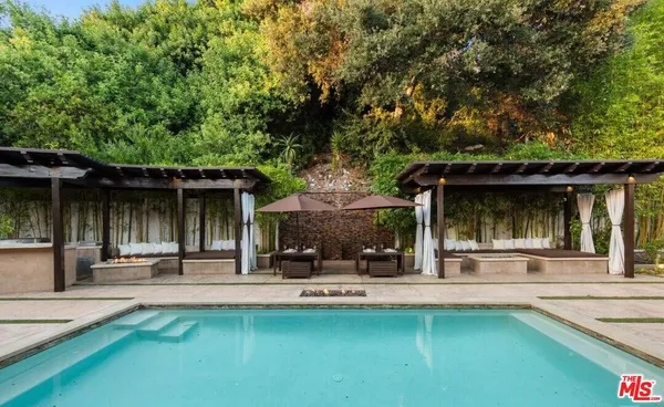 a view of a swimming pool with a patio
